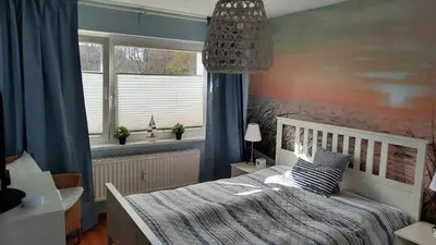 Ein Bett oder Betten in einem Zimmer der Unterkunft Cosy House mit Garten, Hunde willkommen