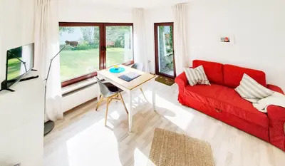 Ein Sitzbereich in der Unterkunft Ferienwohnung Gartenblick - Idylle am Travetal