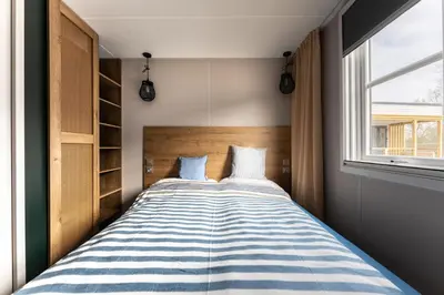 Ein Bett oder Betten in einem Zimmer der Unterkunft Boje 69