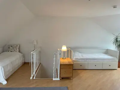Ein Bett oder Betten in einem Zimmer der Unterkunft Ostseewelle Niendorf Parkplatz nur für Autos bis 1,50m Höhe