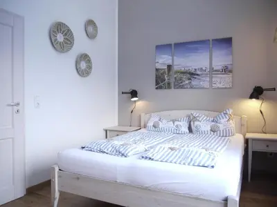 Ein Bett oder Betten in einem Zimmer der Unterkunft Ferienhaus Oceansounds
