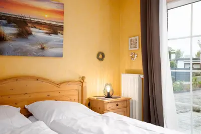 Ein Bett oder Betten in einem Zimmer der Unterkunft BIR9a Ferienwohnung Vahle