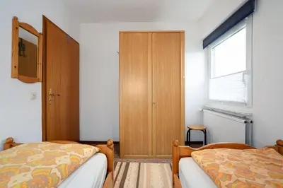 Ein Bett oder Betten in einem Zimmer der Unterkunft HER14a Ferienwohnung Hartig