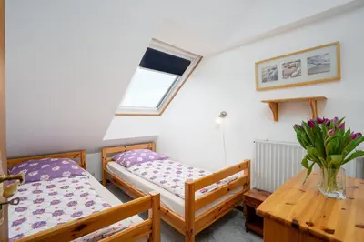 Ein Bett oder Betten in einem Zimmer der Unterkunft HER14b Ferienwohnung Hartig