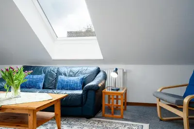 Ein Sitzbereich in der Unterkunft HER14b Ferienwohnung Hartig