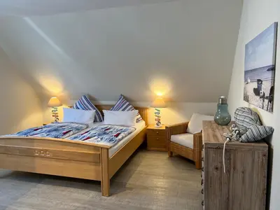 Ein Bett oder Betten in einem Zimmer der Unterkunft STOE12a Ferienhaus Sonne, Wohnung Sonnenaufgang