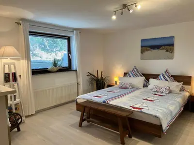 Ein Bett oder Betten in einem Zimmer der Unterkunft STOE12c Ferienhaus Sonne, Wohnung Sonnenschein