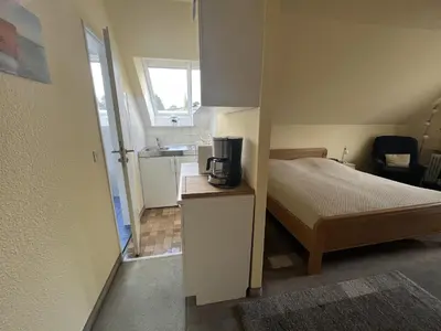 Ein Bett oder Betten in einem Zimmer der Unterkunft STOE14c Gästehaus Iden, App 1