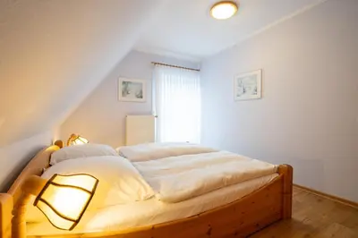 Ein Bett oder Betten in einem Zimmer der Unterkunft STR47a Ferienwohnung Heitmann