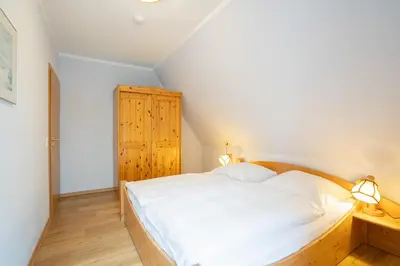 Ein Bett oder Betten in einem Zimmer der Unterkunft STR47a Ferienwohnung Heitmann