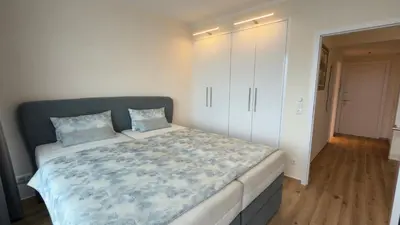Ein Bett oder Betten in einem Zimmer der Unterkunft Miramar Meerblick