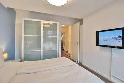 Ein Bett oder Betten in einem Zimmer der Unterkunft Strandduene Stranddüne Appartement 23