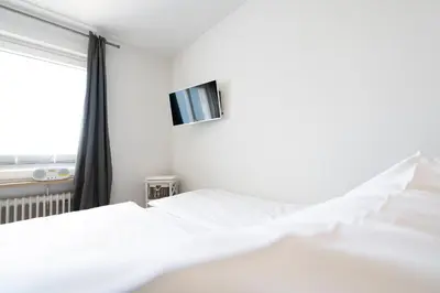 Ein Bett oder Betten in einem Zimmer der Unterkunft Ferienwohnung Capolino Suite