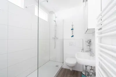 Ein Badezimmer in der Unterkunft Ferienwohnung Capolino Suite