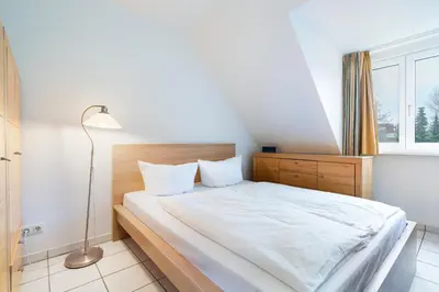 Ein Bett oder Betten in einem Zimmer der Unterkunft Wohnpark am Mühlenteich - Appartement 24