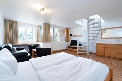 Ein Bett oder Betten in einem Zimmer der Unterkunft Wohnpark am Mühlenteich - Appartement 27a