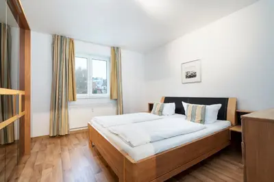 Ein Bett oder Betten in einem Zimmer der Unterkunft Wohnpark am Mühlenteich - Appartement 30