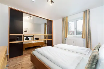 Ein Bett oder Betten in einem Zimmer der Unterkunft Wohnpark am Mühlenteich - Appartement 30