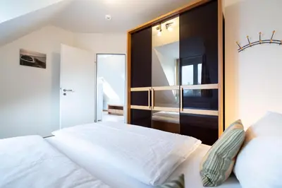 Ein Bett oder Betten in einem Zimmer der Unterkunft Wohnpark am Mühlenteich - Appartement 38