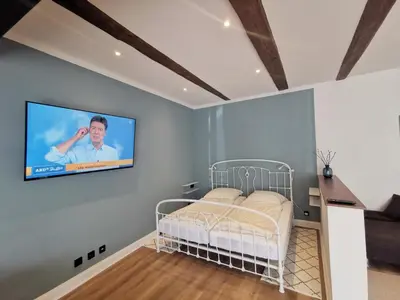 Ein Bett oder Betten in einem Zimmer der Unterkunft Ferienhaus Urban Fewo Alte Backstube 2-4 Personen WLAN gegenüber vom Strand