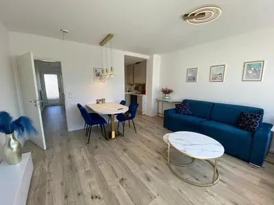 Ein Sitzbereich in der Unterkunft Modernes Apartment an Timmendorfer Promenade, 1. Reihe