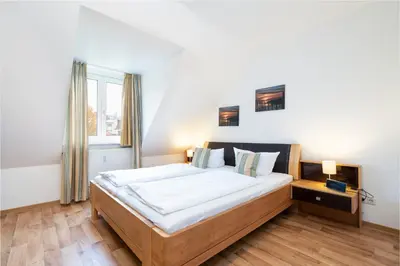 Ein Bett oder Betten in einem Zimmer der Unterkunft Wohnpark am Mühlenteich - Appartement 34