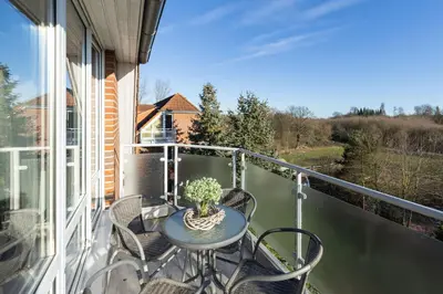 Ein Balkon oder eine Terrasse in der Unterkunft Wohnpark am Mühlenteich - Appartement 36