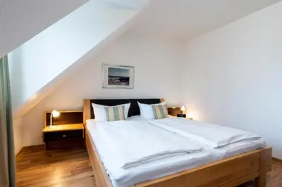 Ein Bett oder Betten in einem Zimmer der Unterkunft Wohnpark am Mühlenteich - Appartement 36