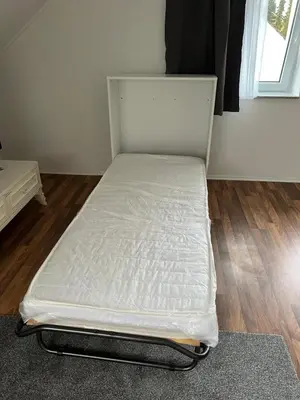 Ein Bett oder Betten in einem Zimmer der Unterkunft FeWo Haus Lübeck Sereetz Ostsee