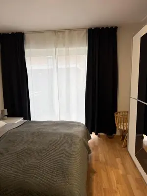 Ein Bett oder Betten in einem Zimmer der Unterkunft Hansehaus Lübeck - Gartensuite