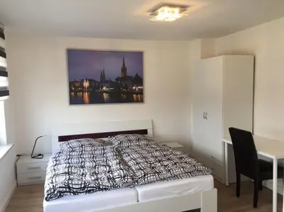 Ein Bett oder Betten in einem Zimmer der Unterkunft Cozy apartment in Luebeck!