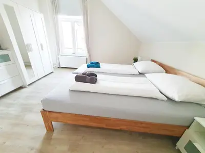 Ein Bett oder Betten in einem Zimmer der Unterkunft Ferienwohnung Stadtvilla - charmante Gemütlichkeit
