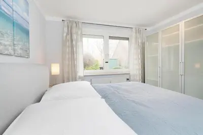 Ein Bett oder Betten in einem Zimmer der Unterkunft Beachtime