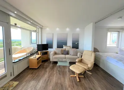Ein Sitzbereich in der Unterkunft Panoramic App B10-7