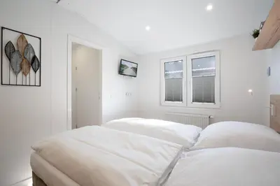 Ein Bett oder Betten in einem Zimmer der Unterkunft Ostseecamp Lübecker Bucht Ferienhaus 