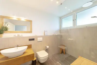 Ein Badezimmer in der Unterkunft Ferienwohnung 54 Grad Nord App 8