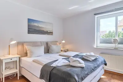 Ein Bett oder Betten in einem Zimmer der Unterkunft Hansa Residenz II Hansa-Residenz II Appartement 9