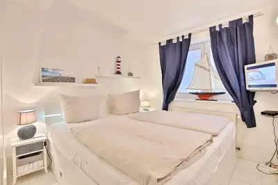 Ein Bett oder Betten in einem Zimmer der Unterkunft Seebrücke Seebrücke Appartement 14