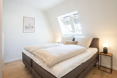 Ein Bett oder Betten in einem Zimmer der Unterkunft Villa Dornkamp 5