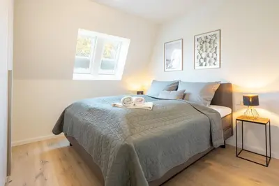 Ein Bett oder Betten in einem Zimmer der Unterkunft Villa Dornkamp 4