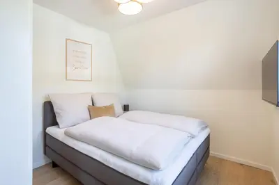 Ein Bett oder Betten in einem Zimmer der Unterkunft Villa Dornkamp 4