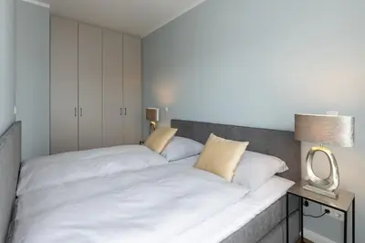 Ein Bett oder Betten in einem Zimmer der Unterkunft Sturmfrei Galerie 2