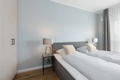Ein Bett oder Betten in einem Zimmer der Unterkunft Sturmfrei Galerie 2